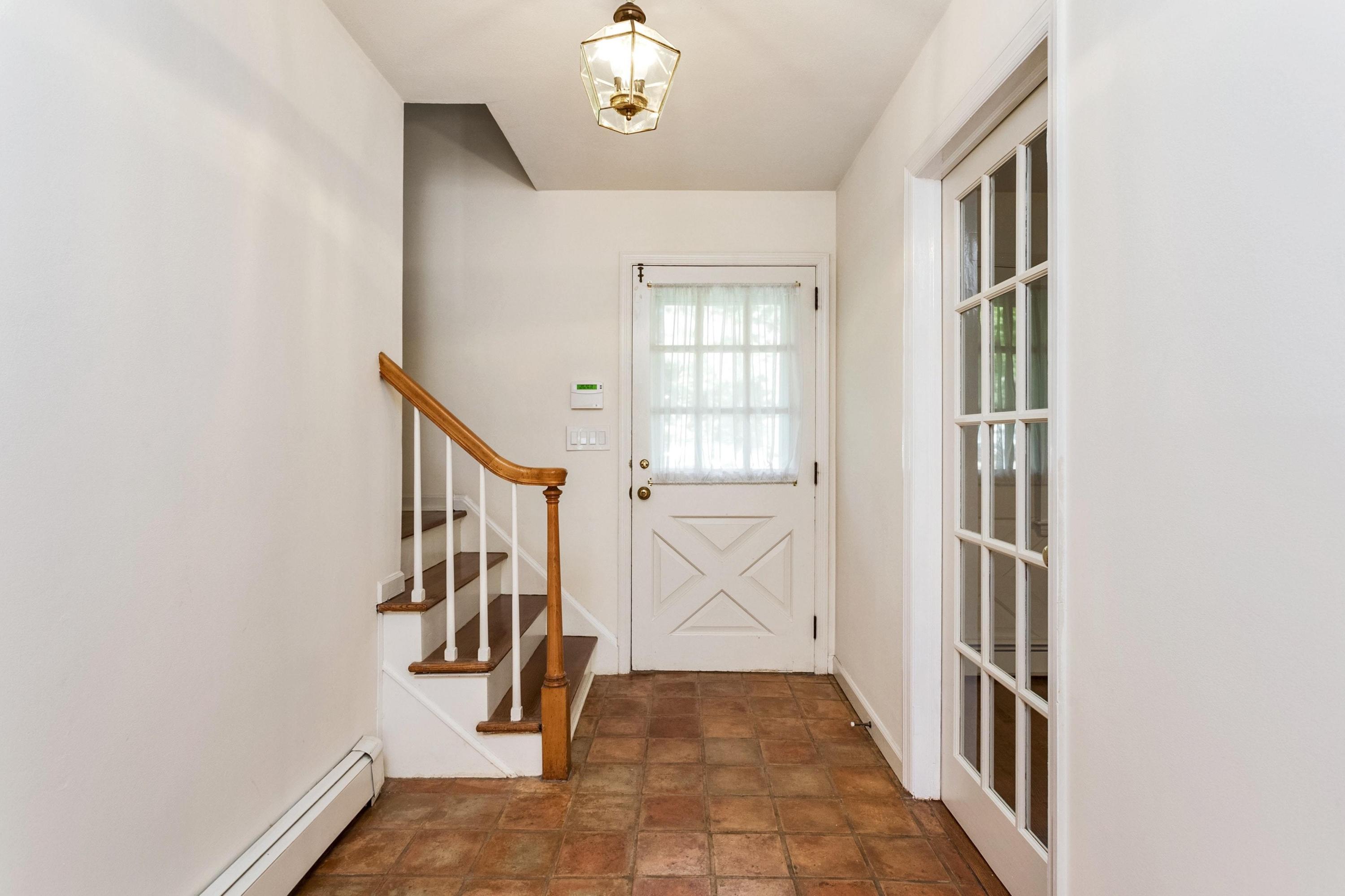 1 Wilson Ridge Road Darien, CT 06820 - Photo 2 of 22 a view of an entryway with staircase