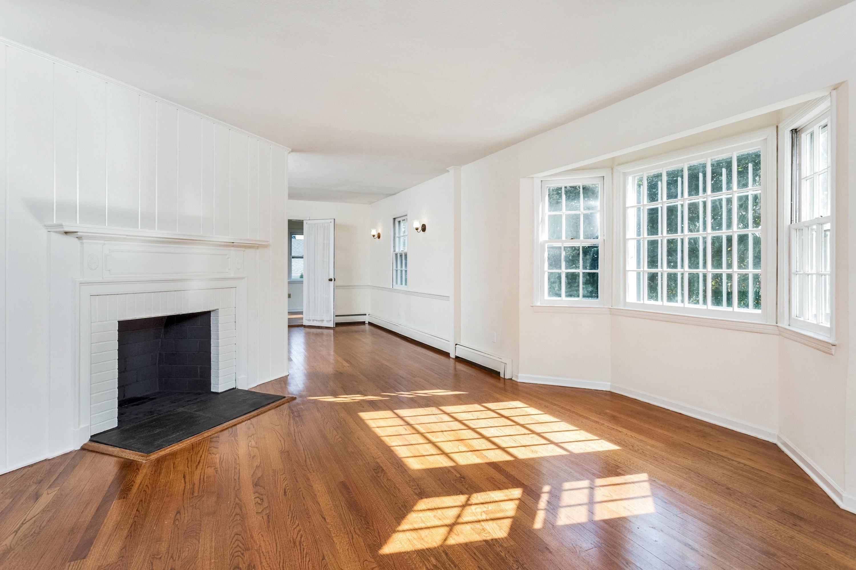 1 Wilson Ridge Road Darien, CT 06820 - Photo 4 of 22 a spacious bedroom with a bed and a fireplace