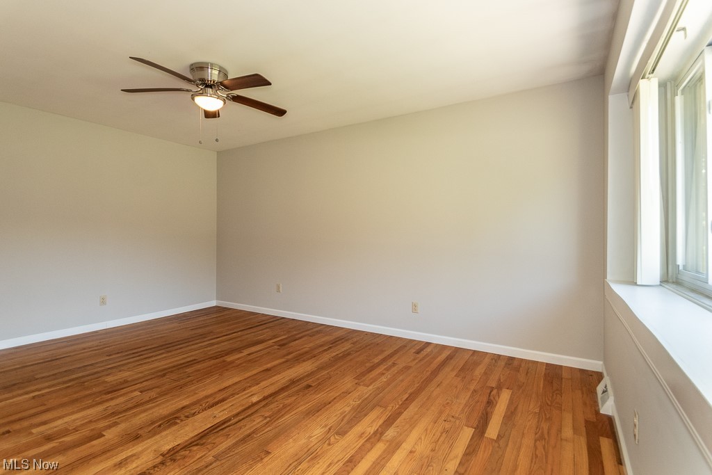 308 Wilson Mills Road Chardon, OH 44024 - Photo 20 of 21 Empty room featuring plenty of natural light, ceiling fan, and light wood-type flooring