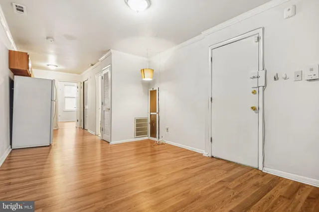 a view of a livingroom with wooden floor