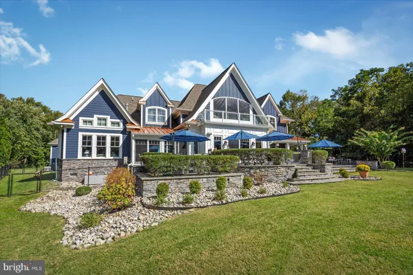 a living room with lots of furniture and a chandelier