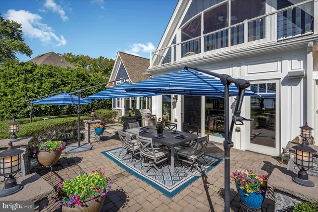 a living room with fireplace furniture and a chandelier