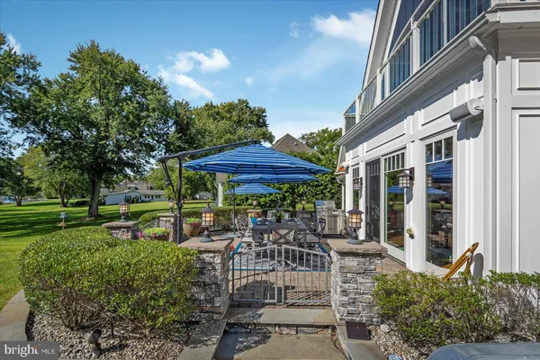 a living room with a fireplace and a floor to ceiling window