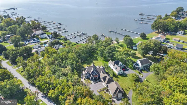 a bathroom with a granite countertop sink a mirror and a shower