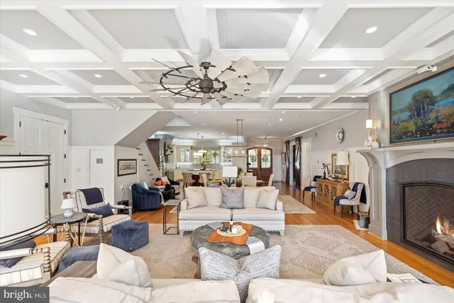 a view of a hallway with wooden floor and closet