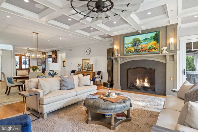 a view of a livingroom with workspace and a window