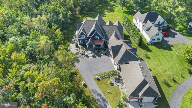 a front view of a house with swimming pool having outdoor seating