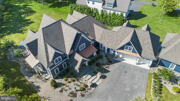 an aerial view of residential house with swimming pool