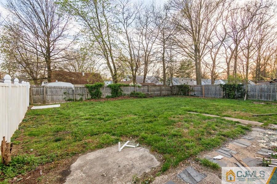 25 Brookville Road Edison, NJ 08817 - Photo 3 of 11 a view of a backyard with a garden