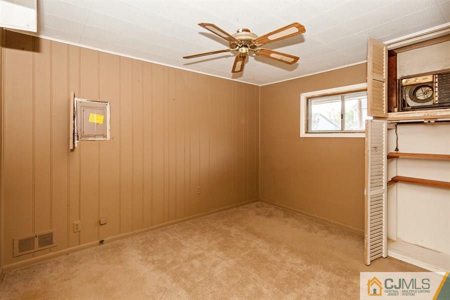 25 Brookville Road Edison, NJ 08817 - Photo 9 of 11 an empty room with windows and fan