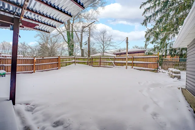 a view of a swimming pool with an outdoor seating