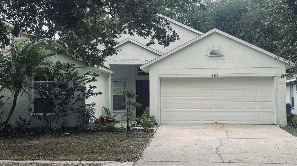 a view of a white house with a outdoor space