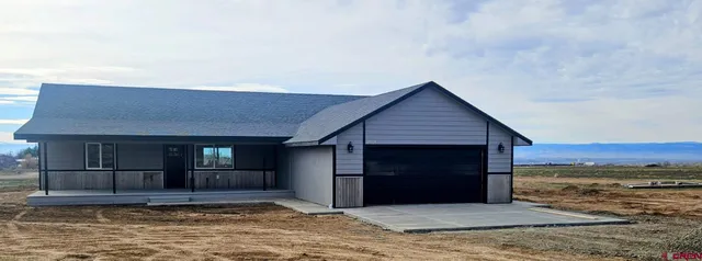 a view of a house with a small cabin