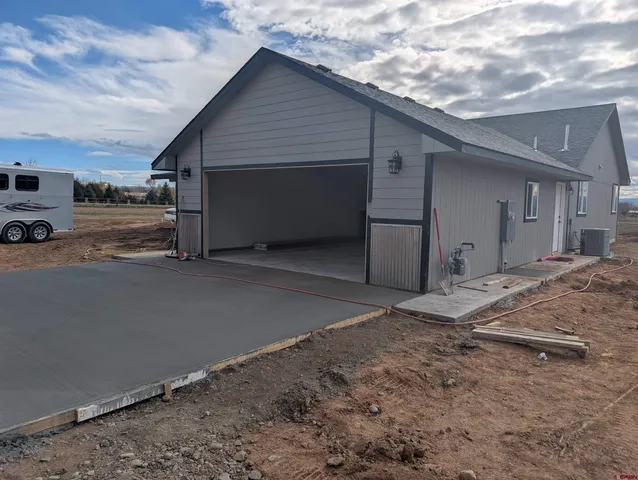 a view of a house with a garage and a garage