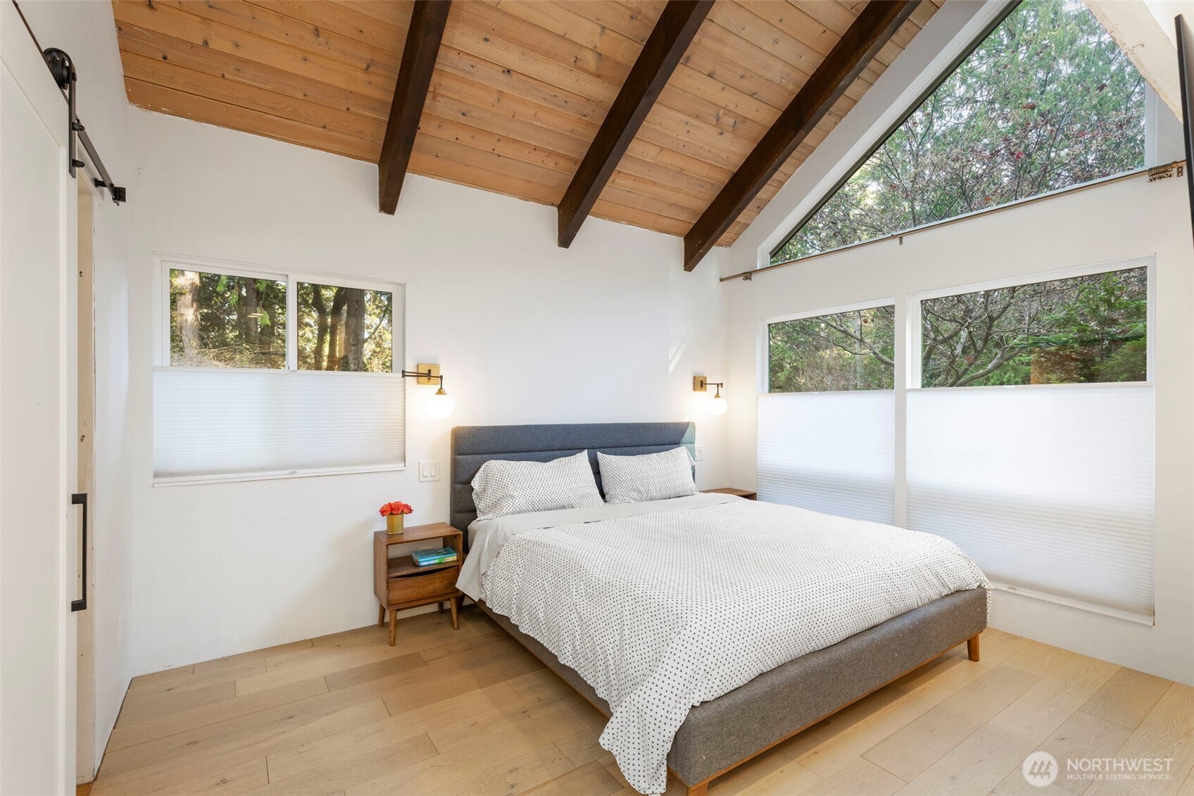 16455 Agate Point Road Northeast Bainbridge Island, WA 98110 - Photo 15 of 26 a bedroom with a bed and a large window