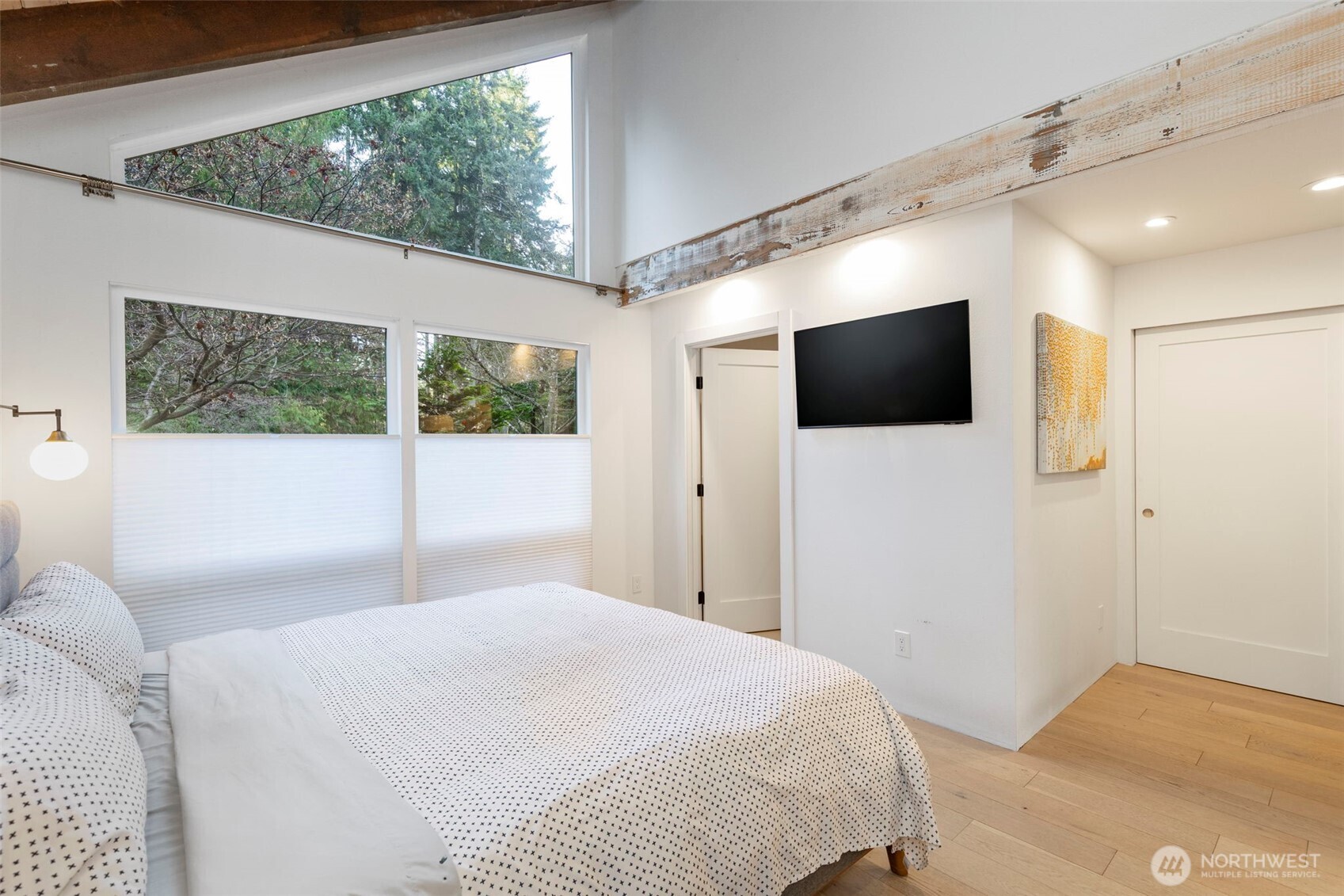 16455 Agate Point Road Northeast Bainbridge Island, WA 98110 - Photo 16 of 26 a bedroom with a large window