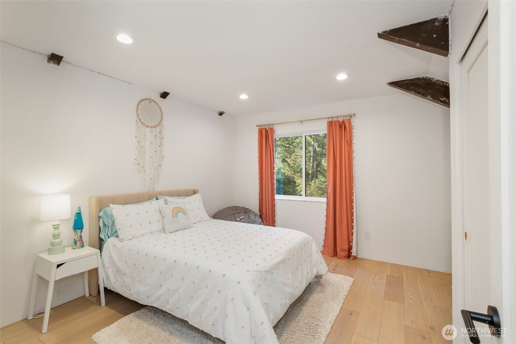 16455 Agate Point Road Northeast Bainbridge Island, WA 98110 - Photo 21 of 26 a bedroom with a large bed and a window