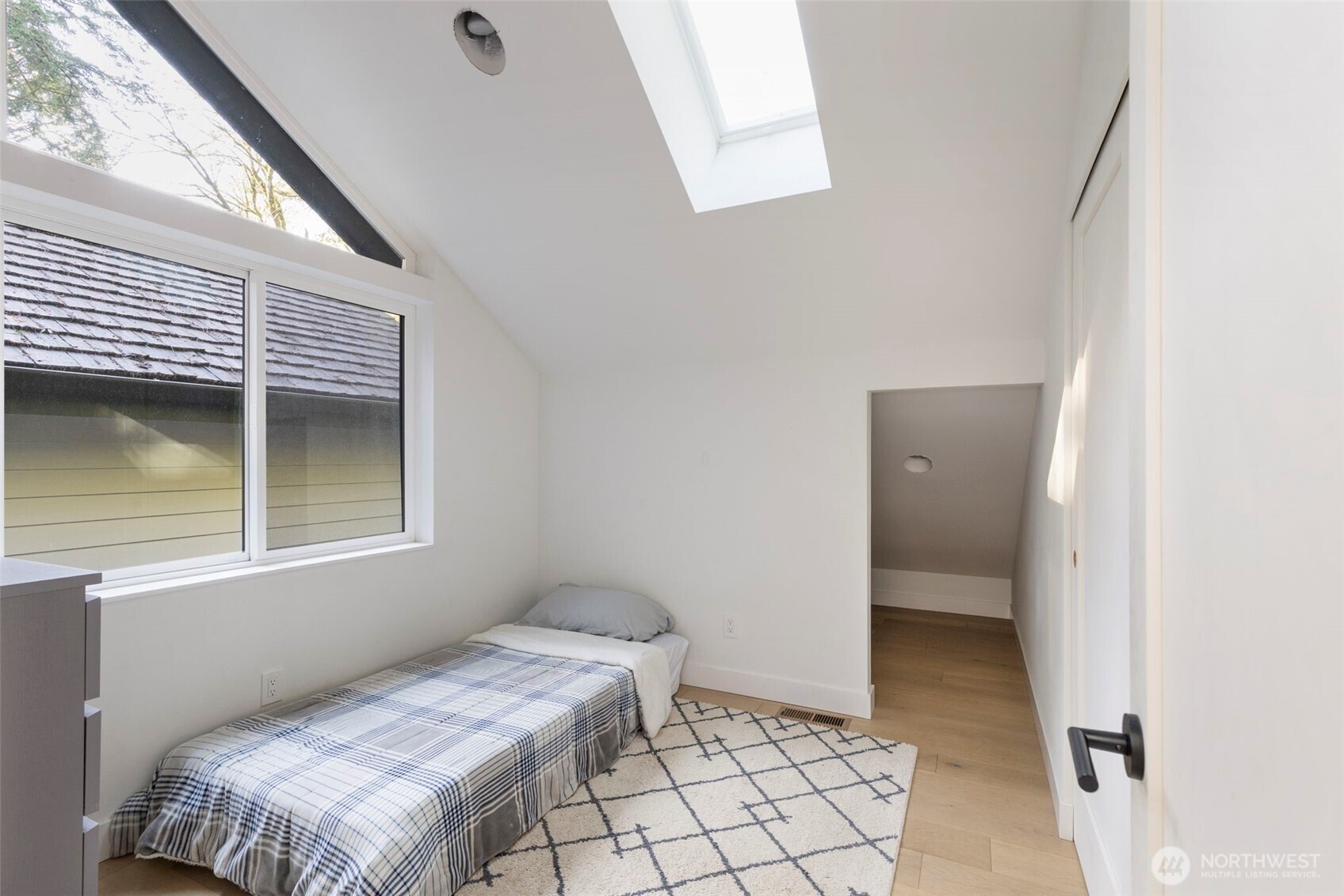 16455 Agate Point Road Northeast Bainbridge Island, WA 98110 - Photo 23 of 26 a bedroom with a bed and a window