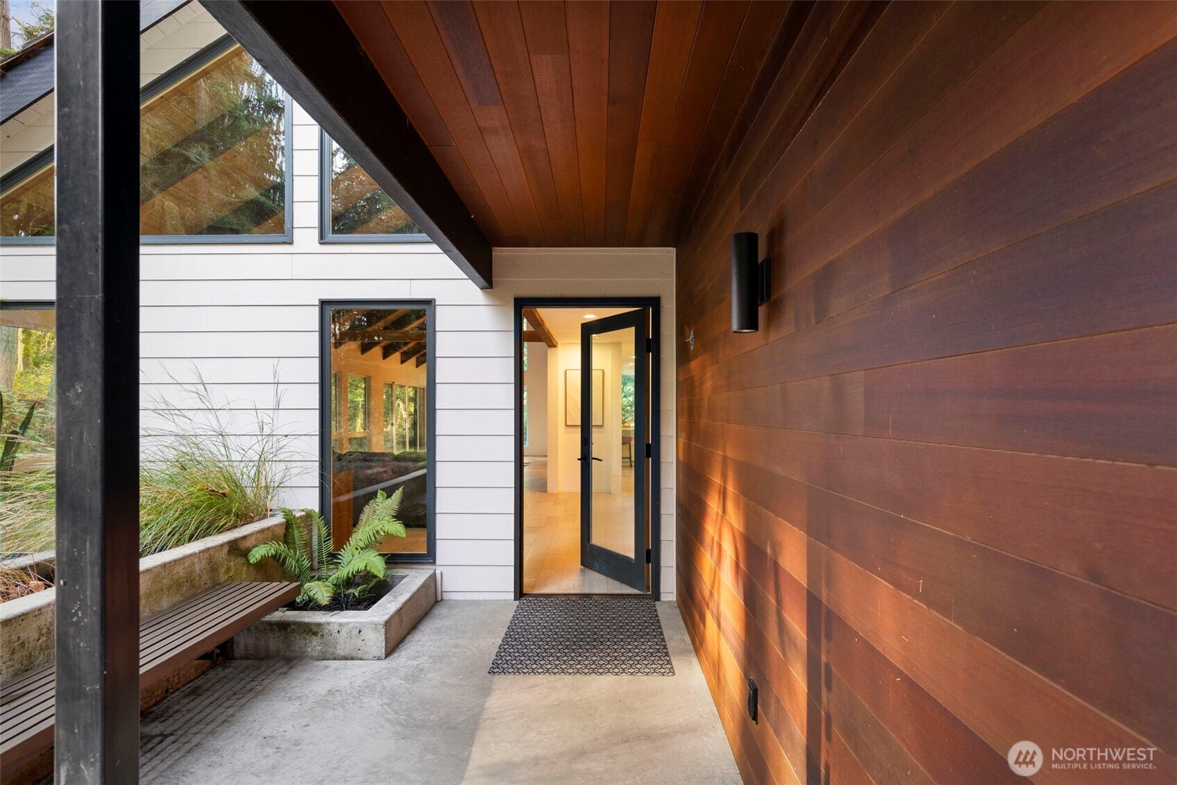 16455 Agate Point Road Northeast Bainbridge Island, WA 98110 - Photo 3 of 26 a view of a hallway with furniture and front door