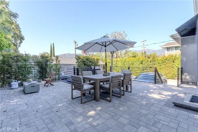 a view of a house with yard and furniture