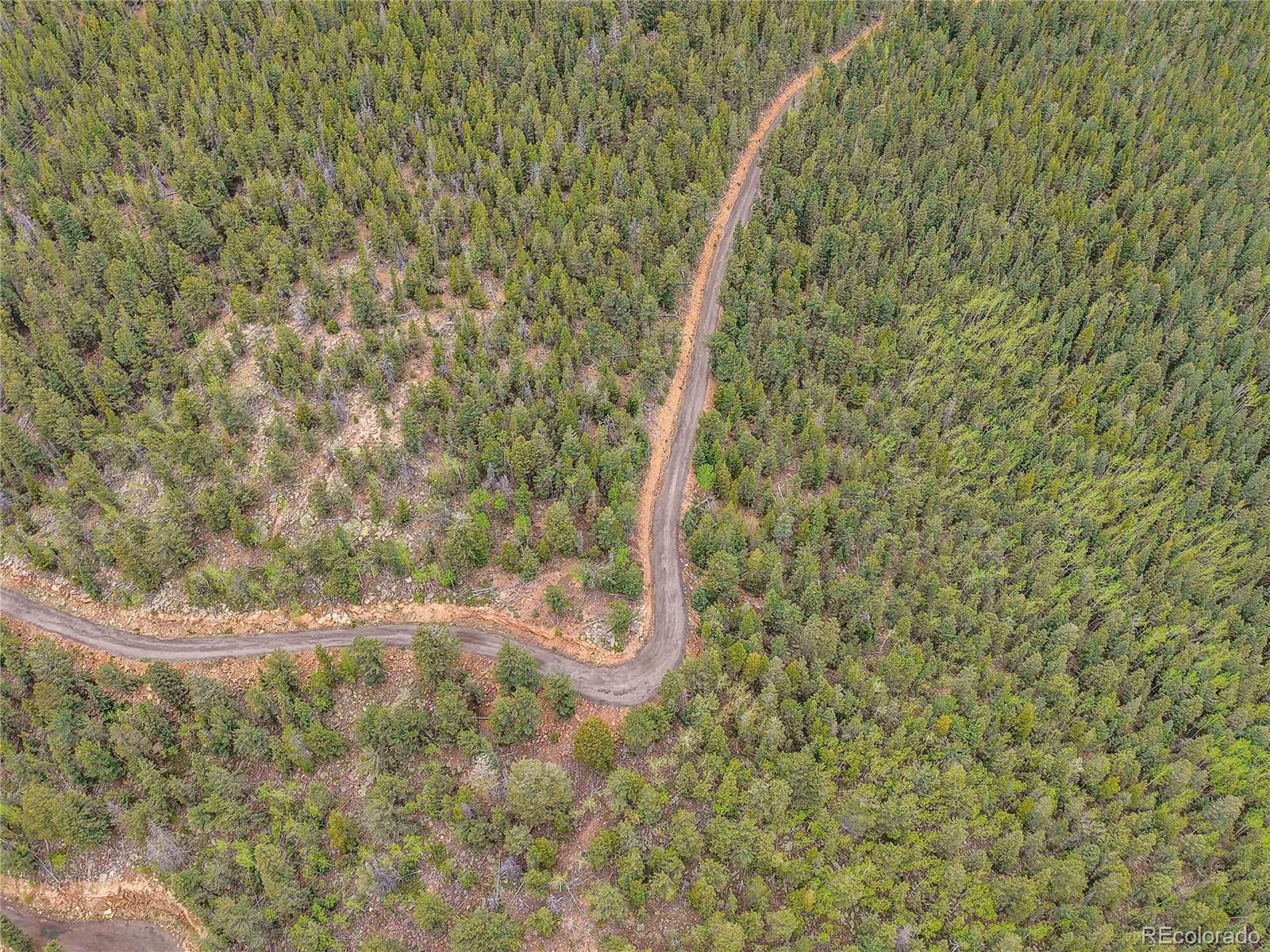 0 Mule Slide Trail Conifer, CO 80433 - Photo 32 of 40 a view of a dry yard with wooden floor and fence