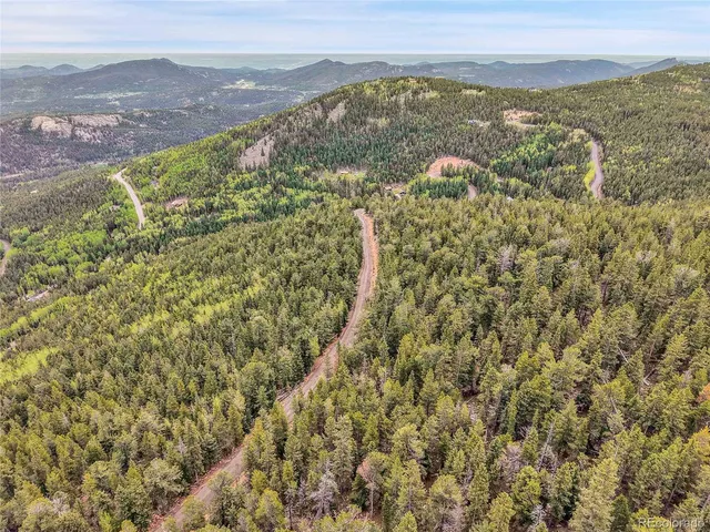 a view of a city with mountains in the background