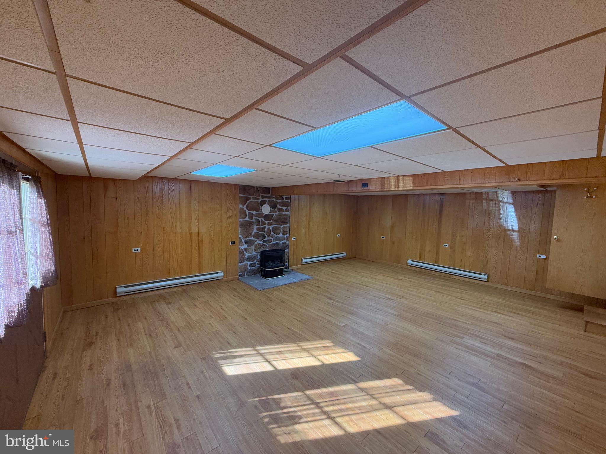 15660 Smith Valley Road Mapleton Depot, PA 17052 - Photo 8 of 118 a view of empty room with wooden floor
