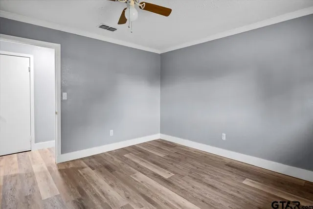 a view of room with wooden floor