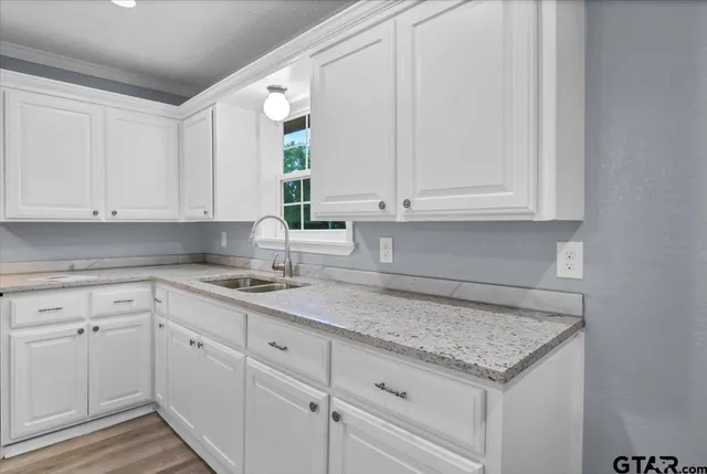 a kitchen with appliances cabinets and a counter top space