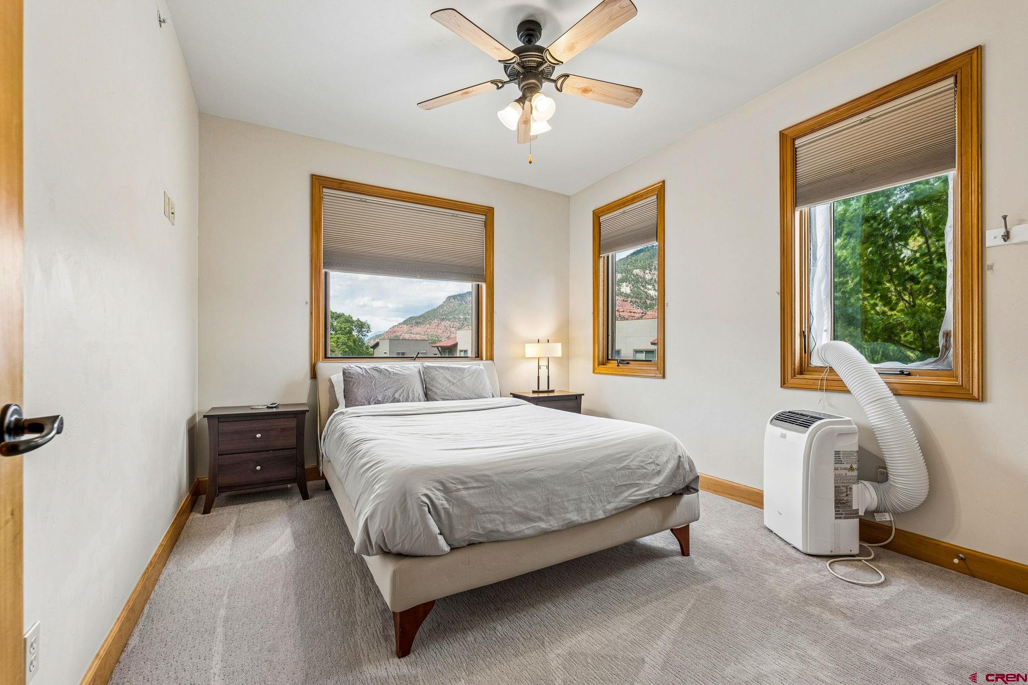 1422 Animas View Drive, Unit 55 Durango, CO 81301 - Photo 34 of 44 a bedroom with a bed and a window