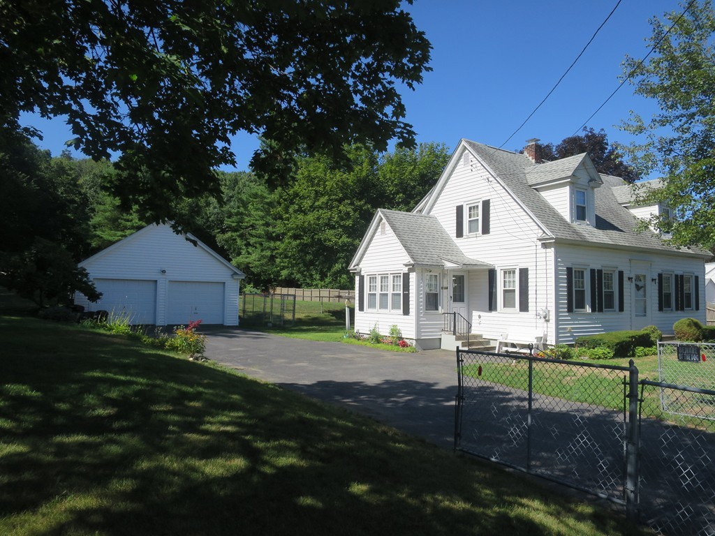 2144 Palmer Road Three Rivers, MA 01080 - Photo 13 of 22 a front view of a house with a yard
