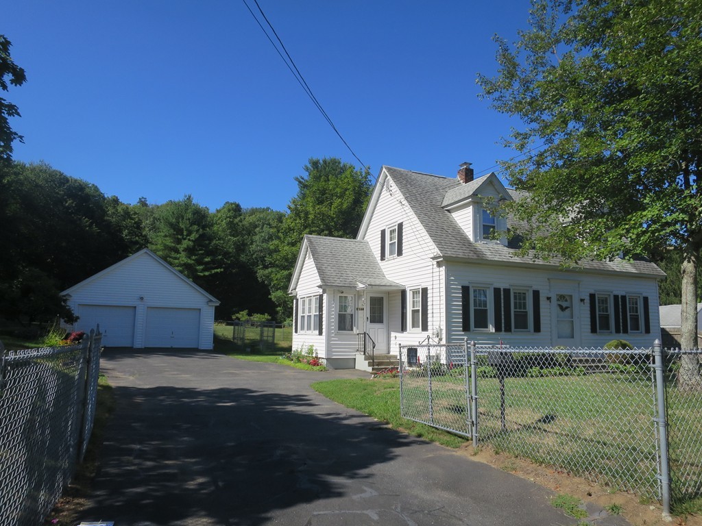 2144 Palmer Road Three Rivers, MA 01080 - Photo 14 of 22 a front view of a house with a yard