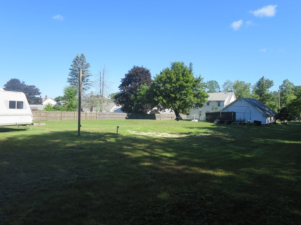 2144 Palmer Road Three Rivers, MA 01080 - Photo 18 of 22 a backyard of a house with lots of green space and outdoor seating