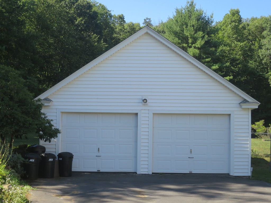 2144 Palmer Road Three Rivers, MA 01080 - Photo 2 of 22 a view of a small house with garage