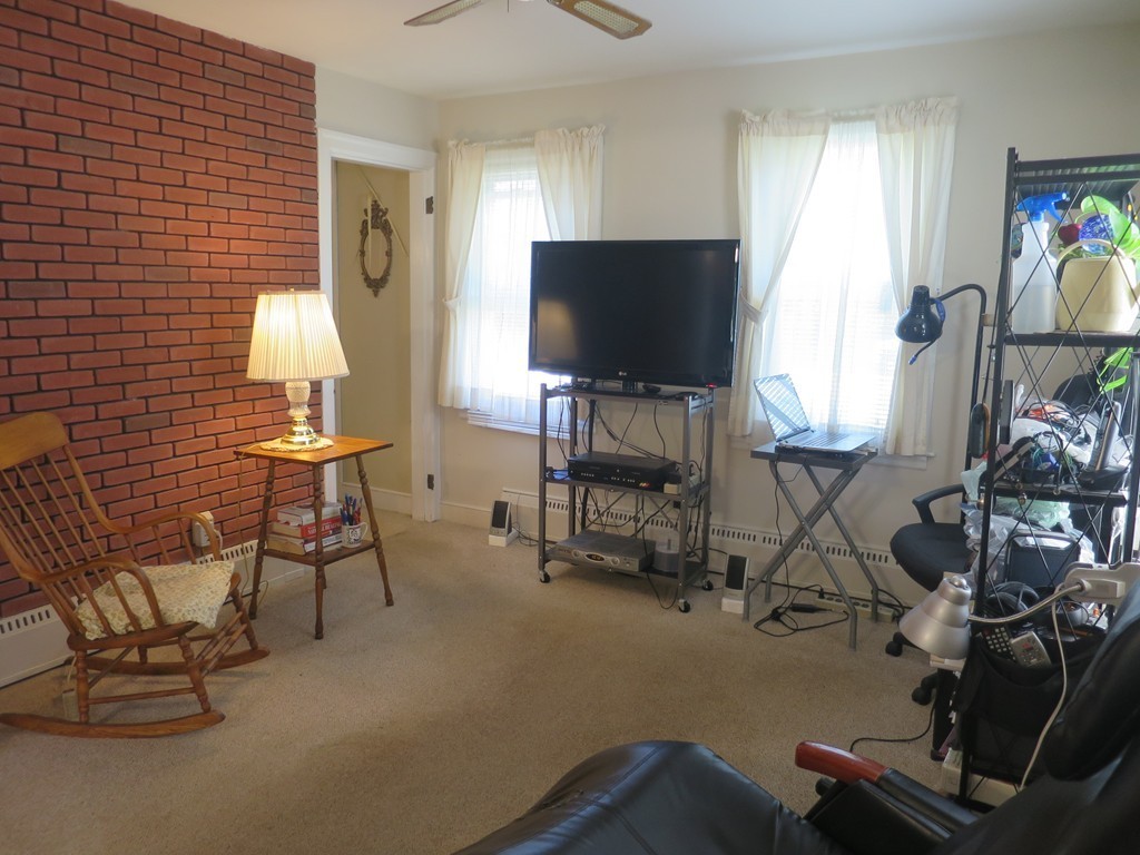 2144 Palmer Road Three Rivers, MA 01080 - Photo 7 of 22 a living room with furniture and a flat screen tv