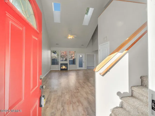 a view of an entryway with wooden floor