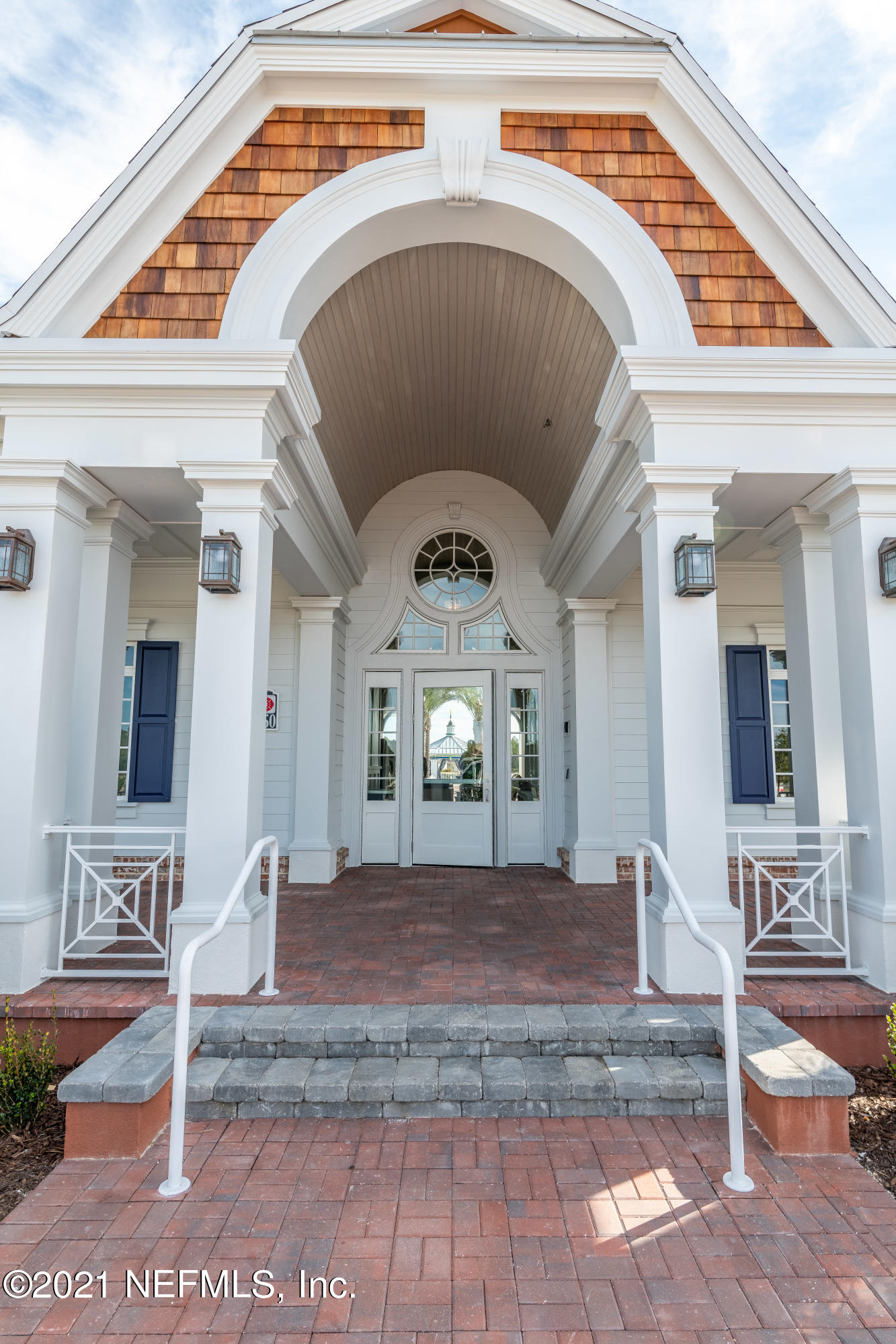319 Charlie Way St. Augustine, FL 32095 - Photo 14 of 36 a view of a hallway with entryway wooden floor and dining table