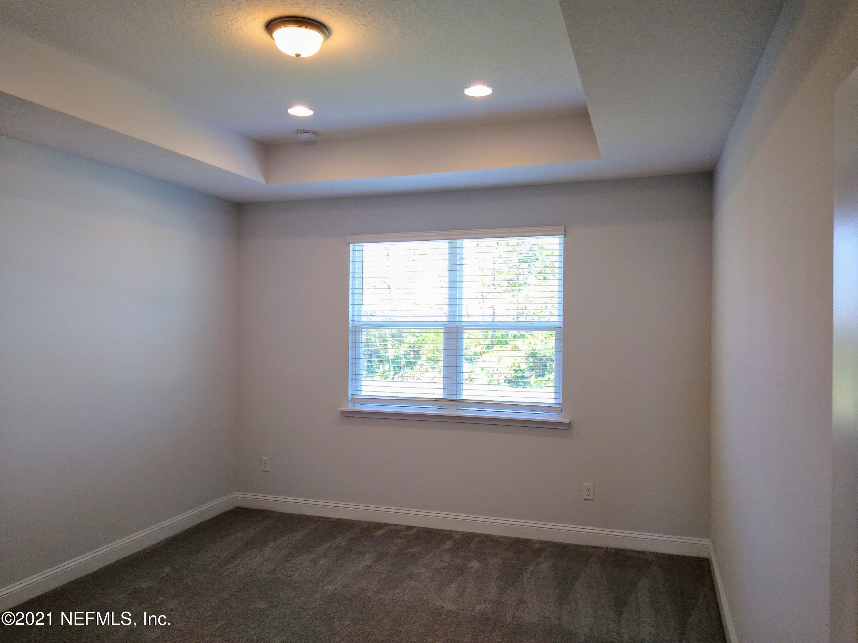 319 Charlie Way St. Augustine, FL 32095 - Photo 7 of 36 an empty room with a window