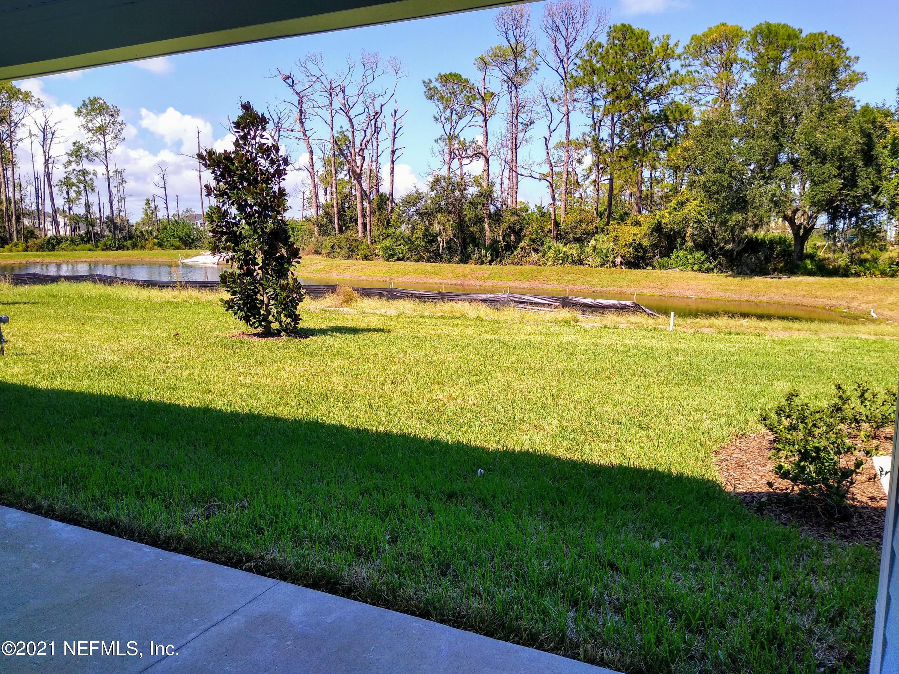 319 Charlie Way St. Augustine, FL 32095 - Photo 9 of 36 a view of a yard with a swimming pool