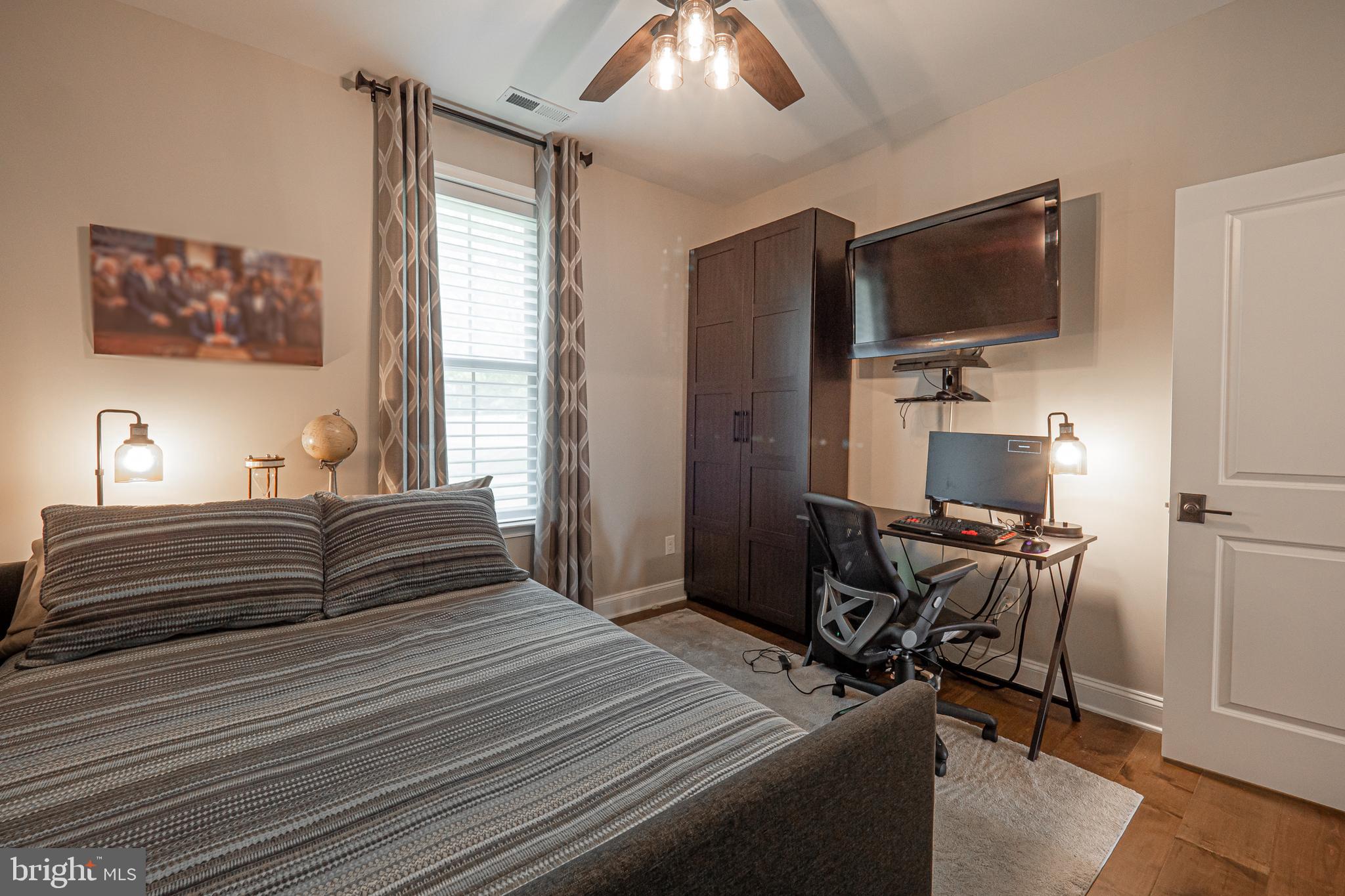 8 Timber Mill Lane, Unit TAGLIO Landenberg, PA 19350 - Photo 31 of 42 a bedroom with furniture and a flat screen tv