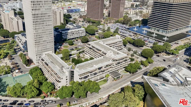 a view of a patio with table and chairs and potted plants