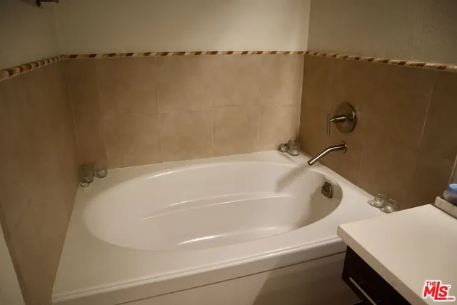 a white bath tub sitting in a bathroom