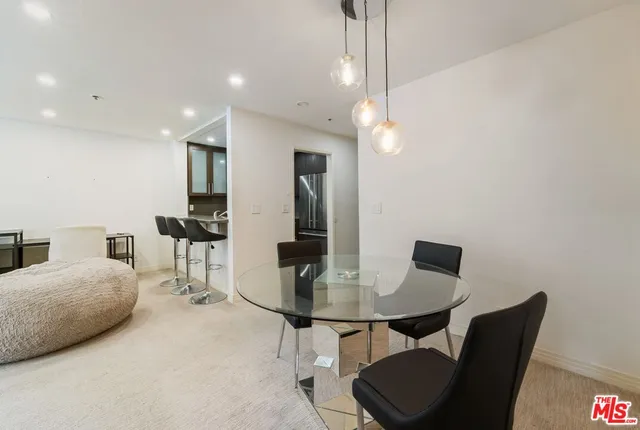 a view of a room with gym equipment and furniture