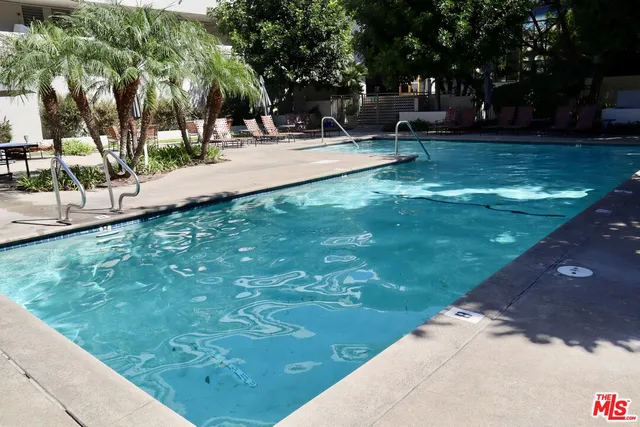 a view of a backyard with sitting area
