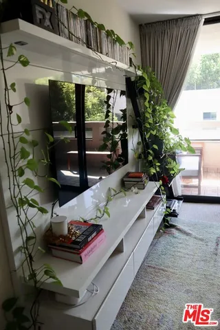 a room with furniture and a potted plant