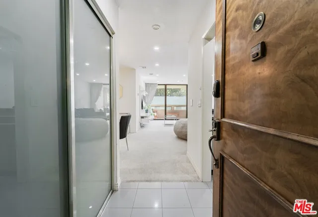 a kitchen with a sink and stainless steel appliances
