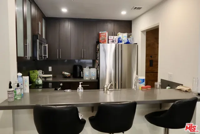 a kitchen with a sink cabinets and window