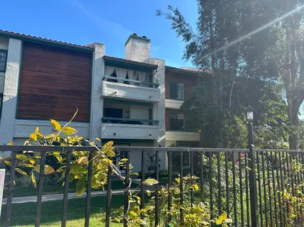 a front view of a house with outdoor seating