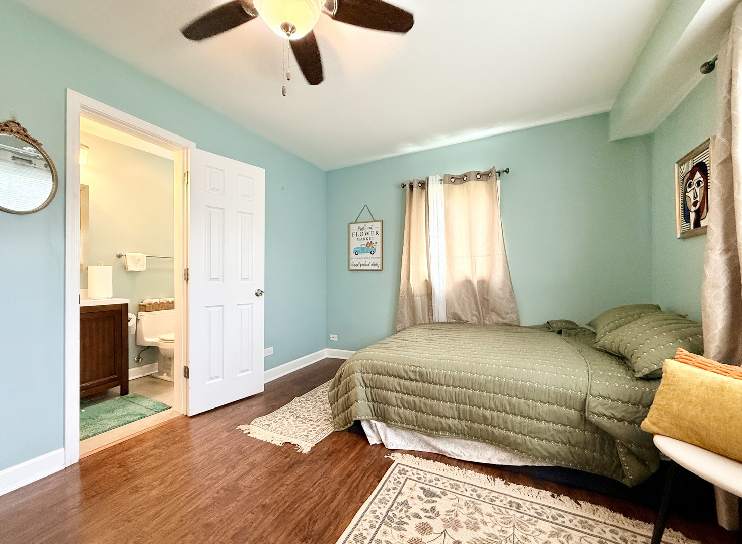 416 North Main Street Mount Prospect, IL 60056 - Photo 7 of 24 a bedroom with a large bed and a chandelier