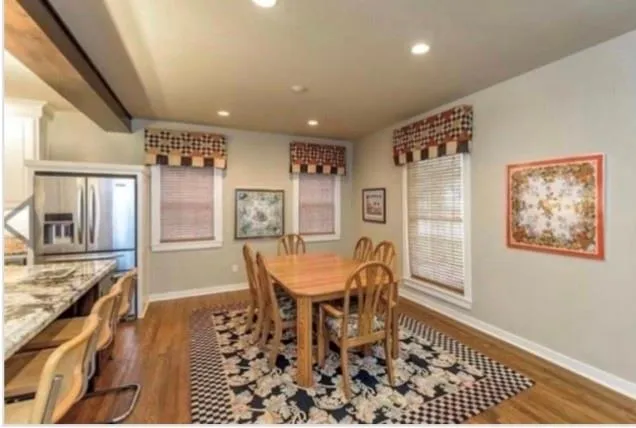 a view of an empty room with cabinet and mirror